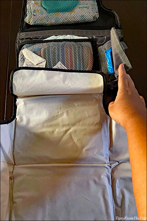 Travel changing pad with pockets for diaper change supplies . 